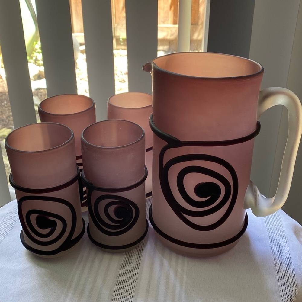 A  five piece set of purple art glass pitcher and glasses
